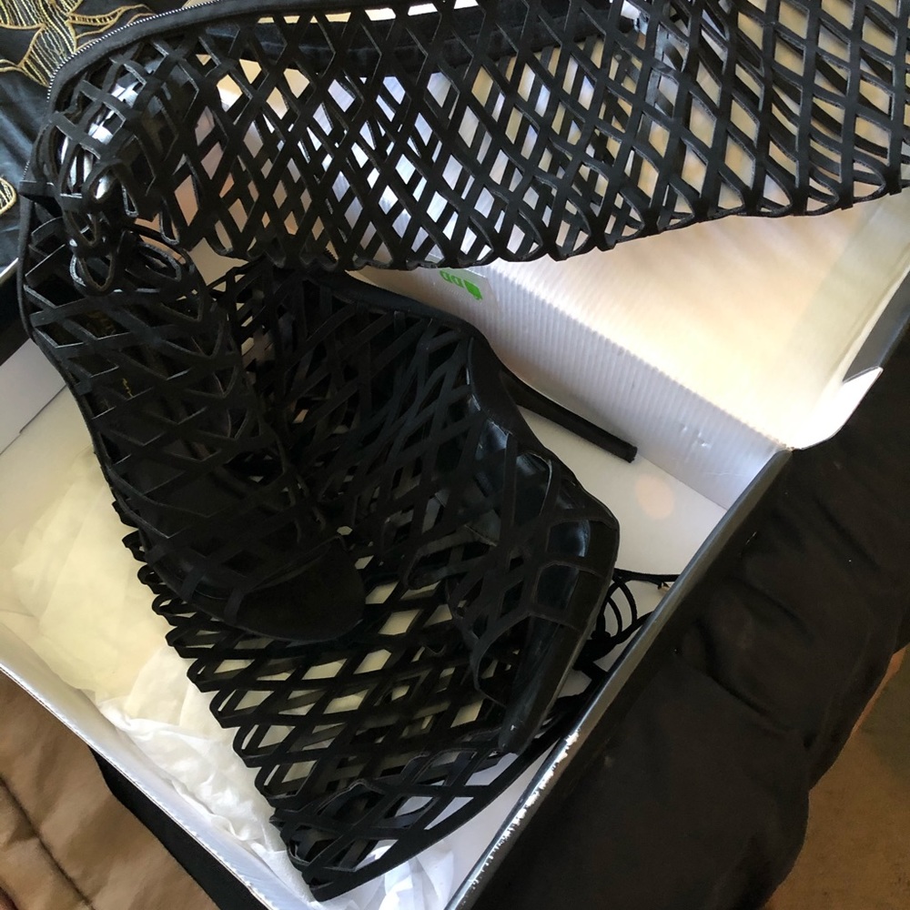 Thigh high heeled sandals